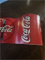 Roll of cardboard Coca-Cola Sign