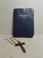 Holy Bible and Cross Necklace.