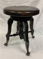 Mahogany organ stool with brass and glass feet