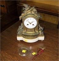 10" French ornate brass clock marked Daubref