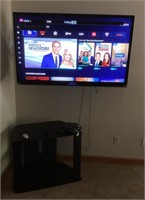 Wall-mounted Toshiba TV plus stand