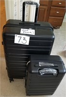 2 Hard Shell Suitcases, never used-2nd floor