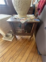 Small wooden end table with glass cabinets