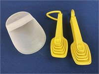 Tupperware scoop and 2 sets of measuring spoons