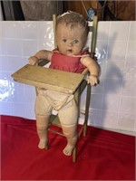 Antique baby doll and highchair