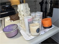 Collection of new candles on stoneware tray