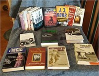 Assortment of books including The Secret