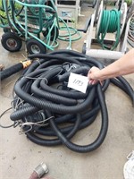 Two sump pumps with hoses