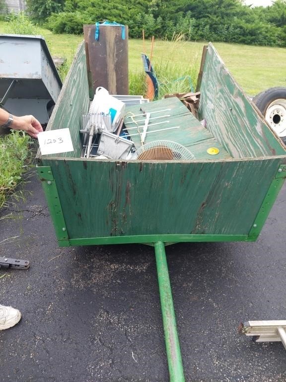 Green trailer, 6' x 4', both tires are flat