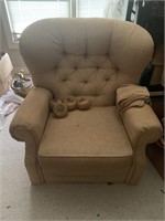 Large tuffeted back chair with round wood feet
