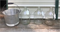 THREE ONE GALLON JUGS AND PAIL