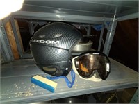 skiers helmet and goggles