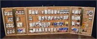 200 +/- dart supplies in a folding wooden display