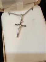 One cross necklace with Jesus.