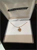 One miniature heart locket necklace
