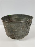 Old galvanized curved bottom bucket tub