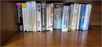 Group of dvds vhs and cassettes