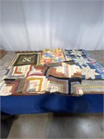 Assortment of quilts and hanging quilt decoration