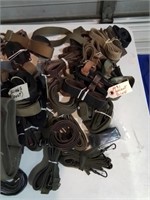 Large group of military field combat gear slings