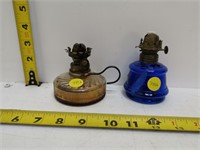 two oil lamps