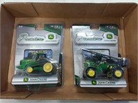 2 JD 1/64 scale tractors