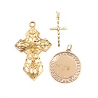 An Assortment of Gold Charms and Pendants
