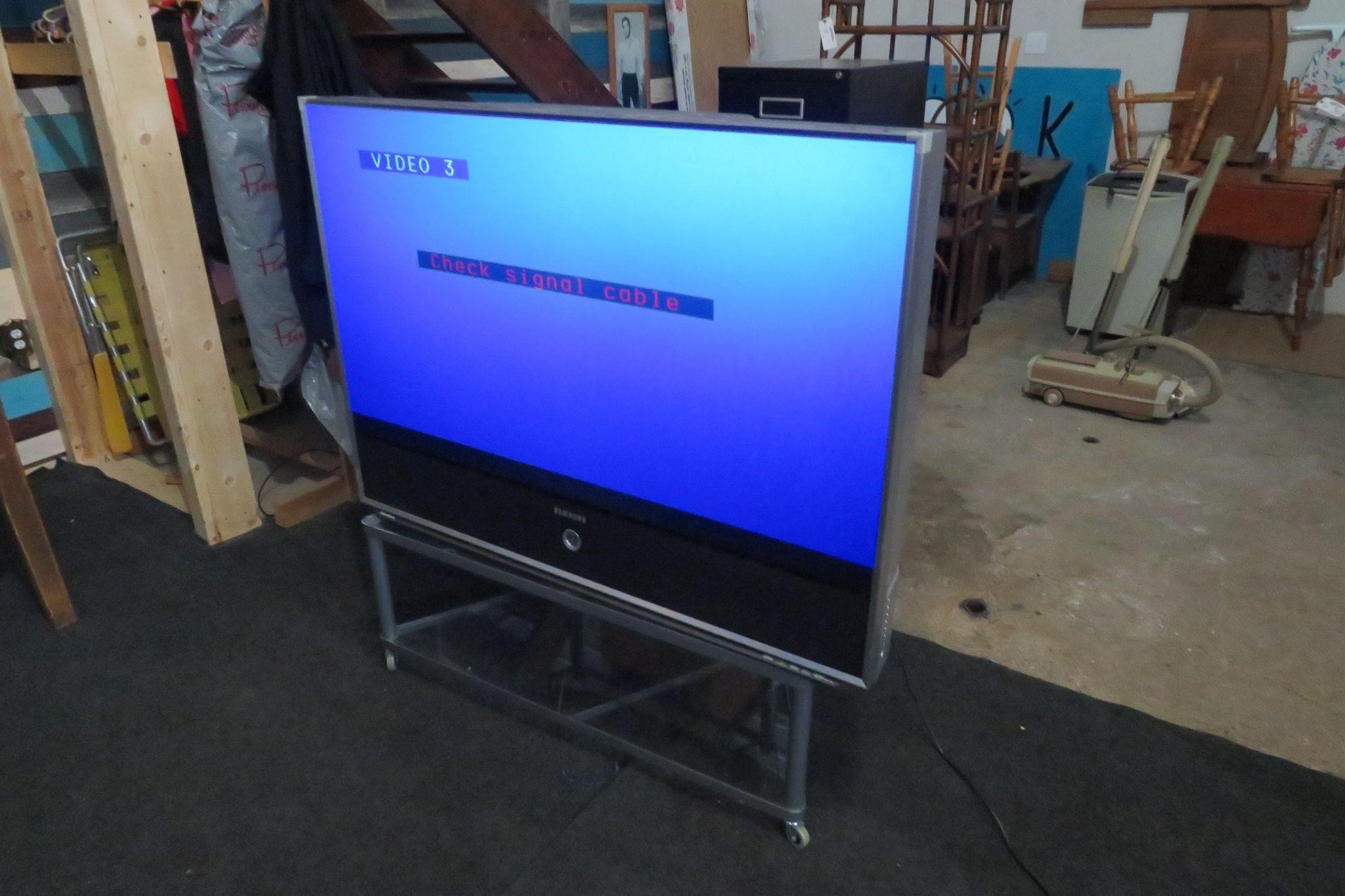 57" SAMSUNG T.V. & STAND ON WHEELS / NO REMOTE