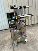 Candy packing machine on casters. Late model unit