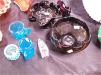 Seven pieces of glass, mostly colored, including