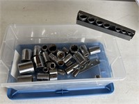 Misc sockets in plastic container with lid