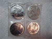 Four 1990 silver dollars