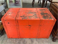 red/orange wood and metal trunk