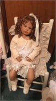 Doll on chair