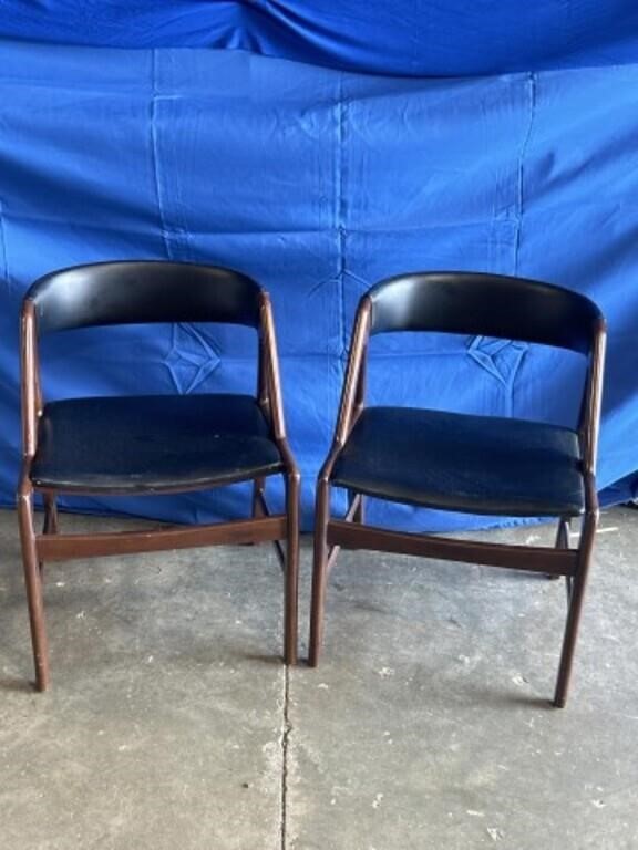 Pair of faux leather and wood chairs