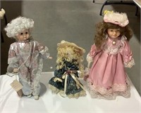 3 dolls on stands