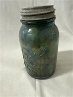 Vintage blue ball mason jar filled with old