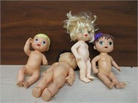 4 Unclothed Dolls