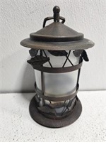 Plastic and metal hanging candle holder