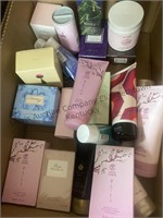 Box of hand cream, parfum sprays, collagen