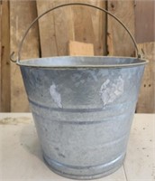 Galvanized bucket filled with marbles