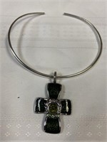 Silver color necklace with green cross