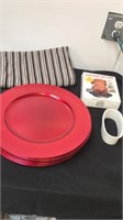 Red plates, chicken holder, table runner