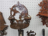 Carved wooden display shelf by Dennis Atkins