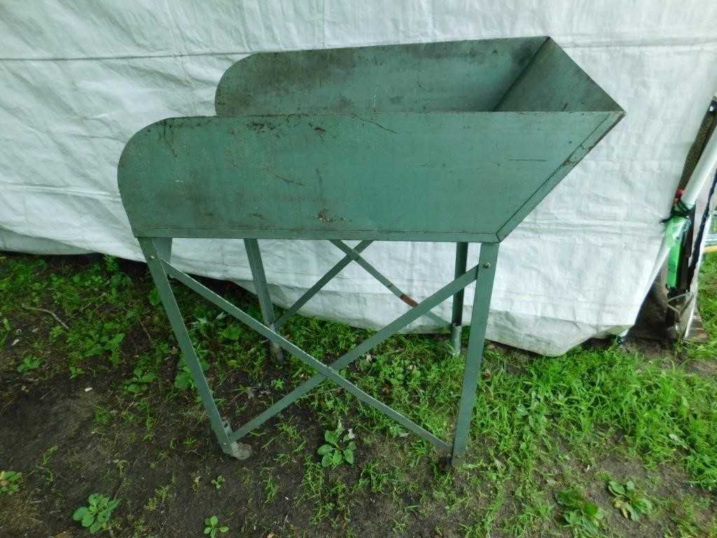 Metal sorting table on wheels.