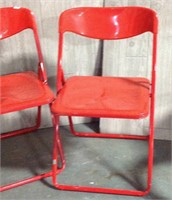 Red plastic folding chairs