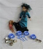 17" doll, Barbie doll, tea cup set and 7 napkin