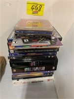 STACK OF DVDS, CDS