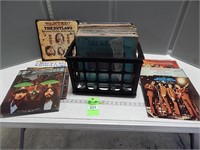 Collection of record albums in a milk crate; buyer