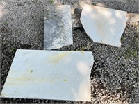 Three slabs of unfinished marble