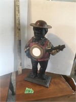 cast iron man playing banjo